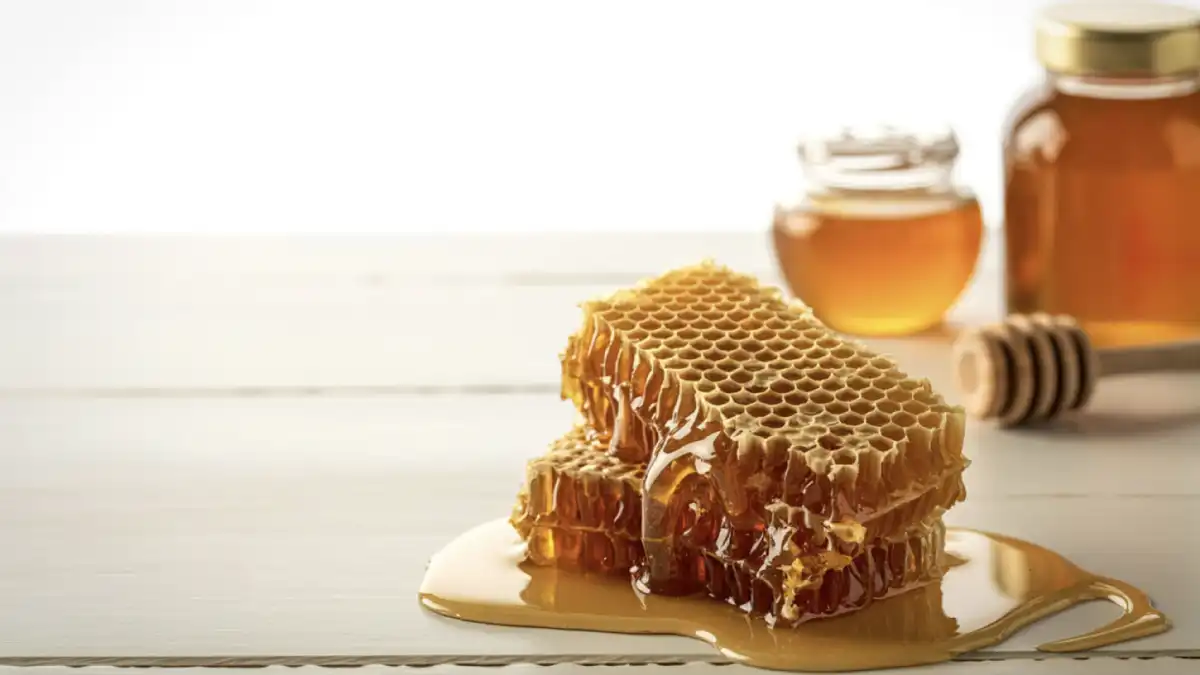 Raw honeycomb with dripping Tanzanian honey